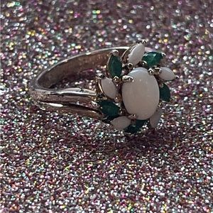 Sterling silver ring with green and white stones.